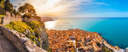 Photo for Aerial view of Cefalu at sunset. Medieval town on Sicily island, Italy. Seashore village with sandy beach, sea, historic buildings and mountains. Popular tourist attraction in Province of Palermo. - Royalty Free Image