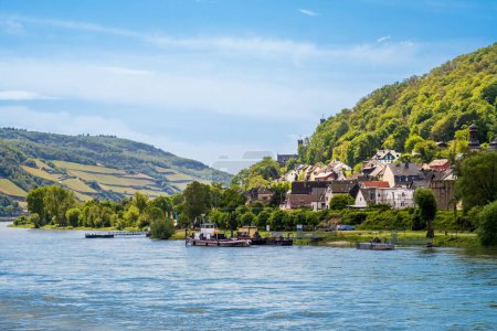 View of Trechtingshausen town on bank of Rhine River in Rhineland-Palatinate, Germany. Rhine valley is famous tourist destination for romantic river cruise and short vacation.
