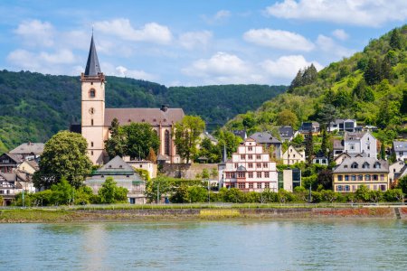 Lorch am Rhein town in Rhine Valley, Germany. Lorch village and St. Martin church seen from river in Hesse region. Rhine valley is famous tourist destination for romantic river cruise or vacation.