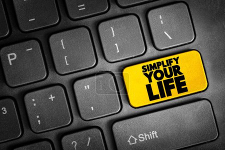 Téléchargez les photos : Simplify Your Life text button on keyboard, concept background - en image libre de droit