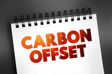 Photo for Carbon offset - reduction of emissions of carbon dioxide made in order to compensate for emissions made elsewhere, text concept on notepad - Royalty Free Image