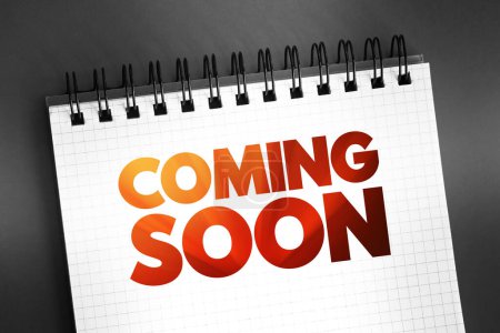 Photo for Coming Soon text on notepad, concept background - Royalty Free Image