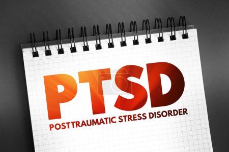 Photo for PTSD Posttraumatic Stress Disorder - psychiatric disorder that may occur in people who have experienced or witnessed a traumatic event, acronym text on notepad - Royalty Free Image