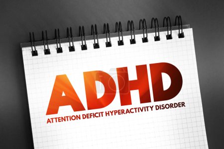 ADHD Attention Deficit Hyperactivity Disorder - neurodevelopmental disorder characterized by inattention, hyperactivity, and impulsivity, acronym text on notepad, concept background