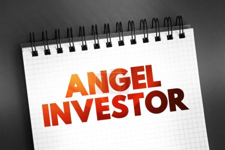Angel investor - individual who provides capital for a business, usually in exchange for convertible debt or ownership equity, text on notepad, concept background