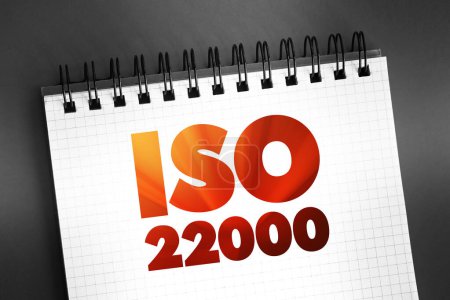 Téléchargez les photos : ISO 22000 - Système de gestion de la sécurité alimentaire qui fournit des exigences pour les organisations de l'industrie alimentaire, concept sur bloc-notes - en image libre de droit