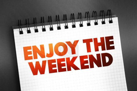 Enjoy the Weekend text quote on notepad, concept background