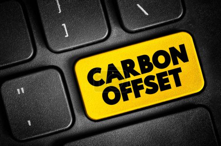 Photo for Carbon offset - reduction of emissions of carbon dioxide made in order to compensate for emissions made elsewhere, text button on keyboard - Royalty Free Image