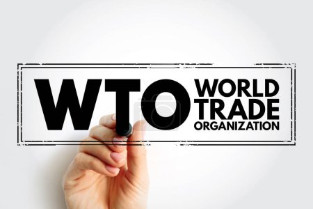 Téléchargez les photos : WTO World Trade Organization - intergovernmental organization that regulates and facilitates international trade between nations, acronym text stamp - en image libre de droit
