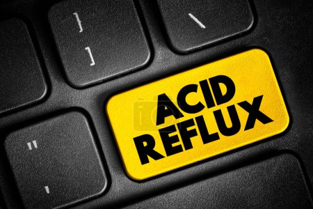 Photo for Acid reflux - common condition that features a burning pain, known as heartburn, in the lower chest area, text button on keyboard, concept background - Royalty Free Image