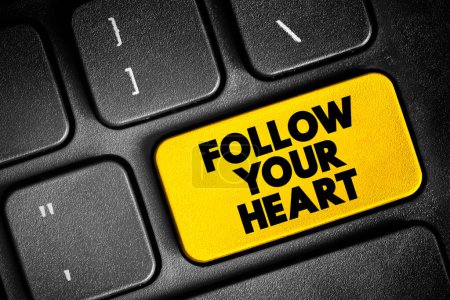 Foto de Follow Your Heart text button on keyboard, concept background - Imagen libre de derechos