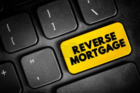 Téléchargez les photos : Reverse Mortgage - secured by a residential property, that enables the borrower to access the unencumbered value of the property, text concept button on keyboard - en image libre de droit