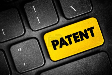 Foto de La patente es un derecho exclusivo concedido para una invención, botón de texto en el teclado, fondo concepto - Imagen libre de derechos