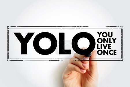 Téléchargez les photos : YOLO - You Only Live Once acronym text stamp, concept background - en image libre de droit