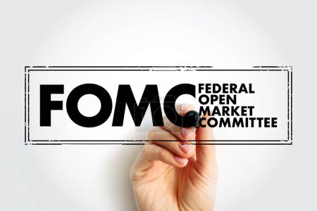 FOMC Federal Open Market Committee acronym - committee within the Federal Reserve System, conducts monetary policy for the U.S. central bank, text concept stamp