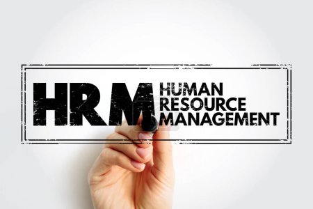 HRM - Human Resource Management is the strategic approach to the effective and efficient management of people in a company or organization, acronym business concept stamp