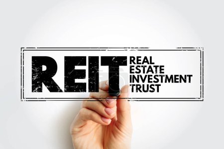 REIT - Real Estate Investment Trust is a company that owns, and in most cases operates, income-producing real estate, acronym business concept stamp