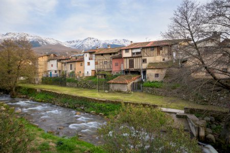 Hervas view of his Jewish neighborhood next to the river and the mountains in the background