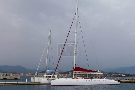 Photo for A large white sailing yacht stands moored at the pier - Royalty Free Image