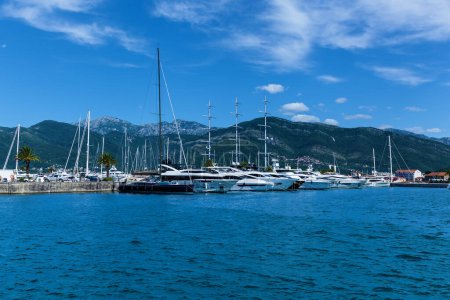 Photo for Motor and sailing yachts and boats are moored on the pier - Royalty Free Image
