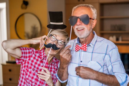 Photo for Happy mature couple is having fun at home. - Royalty Free Image