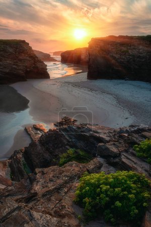 Photo for Cathedrals beach (Playa de las Catedrales) or Praia de Augas Santas at sunrise, amazing landscape with rocks on the Atlantic coast and colored sky, Ribadeo, Galicia, Spain. Outdoor travel background - Royalty Free Image