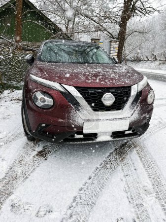 Photo for 03.02.2023 Kyiv, Ukraine : New Nissan Juke 2022 year in Burgundy color at winter time - Royalty Free Image