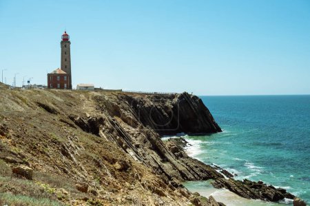 Photo for View of the Penedo de Sausade lighthouse on the Atlantic Coast of Portugal. Sao Pedro de Moel, Portugal. - Royalty Free Image
