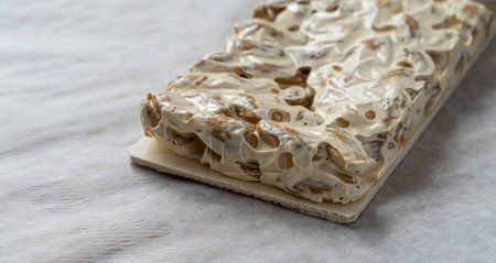 Photo for Side view, piece of artisan almond nougat - Royalty Free Image