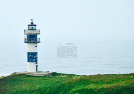 Photo for 1046:Galician coast, Isla Pancha Lighthouse in Ribadeo, Galicia, Spain. - Royalty Free Image