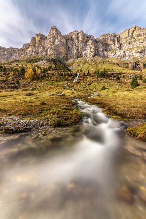 The magic of the autumn landscape of Ordesa, one of the many waterfalls that adorn the valley of La Cascada del la Cola del Caballo in Monte Perdido, Huesca