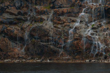 Photo for Waterfall Loud threshold on the slope of the Monastery Island in the Dnieper, Ukraine. Artificial decorative waterfall. - Royalty Free Image