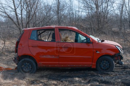 A damaged car after a missile attack on a private residential area. War in Ukraine, the city of Dnipro. Damn car. War concept. Broken windows.