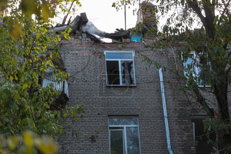Photo for A Russian missile hit a residential building in the city of Dnepr, Ukraine. Damaged apartment building after a massive missile attack on 04/19/24. Scars of war. Consequences of the attack - Royalty Free Image