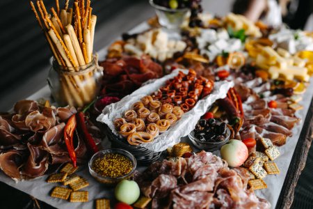 Photo for Gourmet charcuterie board filled with an assortment of meats, cheeses, and accompaniments. - Royalty Free Image