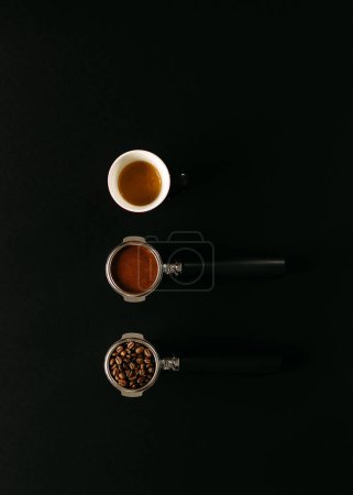 Photo for A top-down composition features coffee in various stages: beans, ground and espresso shot, all against a black background. - Royalty Free Image