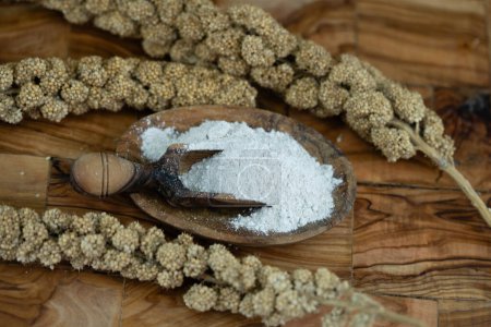 Dried millet flour on olive wood