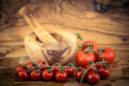 fresh tomato vinegar on olive wood