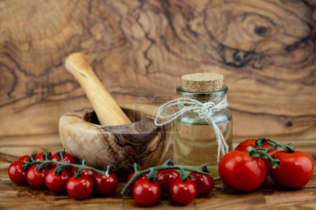 fresh tomato vinegar on olive wood