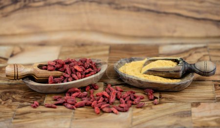 Photo for Dried goji berries on olive wood - Royalty Free Image