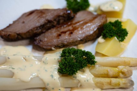 Tafelspitz of veal with asparagus and parsley sauce