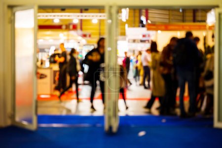 Téléchargez les photos : Entrance to Exhibition. Blurred Shot Of People Walking Indoors At Food And Food Technology Exhibition, Riga, Latvia. High quality photo - en image libre de droit
