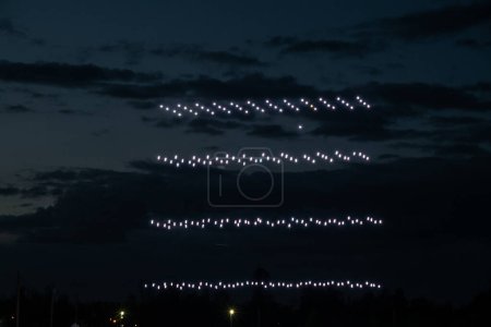 Riga, Latvia - 27.04.2023: Baltic Drone Show, rows of drones descend to the ground after the show. . High quality photo