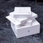 Jurmala, Latvia - 21 09 2023: Four white boxes from Apple devices are in a stack. First unboxing - AirPods pro 2, MagSafe Charger, AirTag, Adapter from Lightning to Headphone Jack. High quality photo