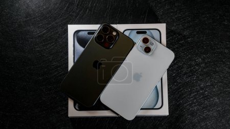 Photo for Jurmala, Latvia - 09 01 2024: On Black table on white box with new iPhone 15 Blue Titanium and iPhone 15 Plus in Blue color on black table. High quality photo - Royalty Free Image