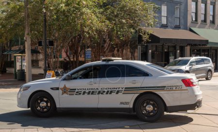Photo for DeLand, Florida, USA. 2022. Volusia county Sheriffs car driving through downtown DeLand, Florida. - Royalty Free Image