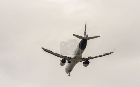 Photo for Herkalion, Crete, Greece, EU. 2023. A German passenger jet with flaps extended and undercarriage down on finals to land. An underside view. - Royalty Free Image