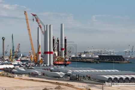 Photo for Port of Le Havre northern France. 2023. Offshore wind turbine installation ship loading turbine blades  bound for St Brieuc wind farm, off Brittany. - Royalty Free Image