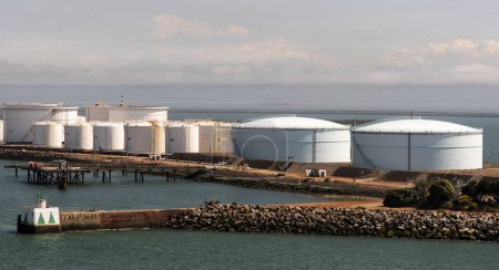 Photo for Le Havre, northern France, Europe. 2023. Oil and gas storage  tanks alongside a jetty in the Port of Le Havre, France. - Royalty Free Image