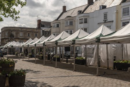 Photo for Wells, Somerset, England, UK.  21 June 2023.  Wells town centre, market day stalls empty and about to be removed at the close of business. - Royalty Free Image
